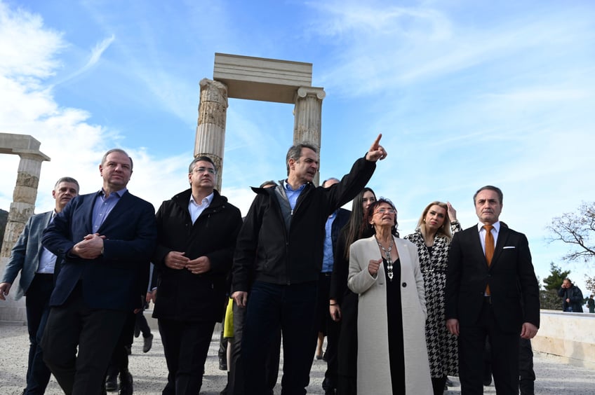 Greece's Prime Minister Kyriakos Mitsotakis, center, visits the Palace of Aigai, built more than 2,300 years ago during the reign of Alexander the Great's father, after it fully reopened in ancient Aigai, some 65 kilometers (40 miles) southwest of the port city of Thessaloniki, northern Greece, on Friday, Jan. 5, 2024. It was the largest building of classical Greece: The palace where Alexander the Great was proclaimed king before he launched a conquest that took him as far as modern-day Afghanistan. (AP Photo/Giannis Papanikos)