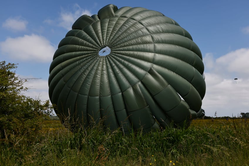 Parachute drop in Carentan-Les-Marais in Normandy, France on Sunday, June 02, 2024, ahead of D-Day 80th anniversary commemorations. (AP Photo/Jeremias Gonzalez)