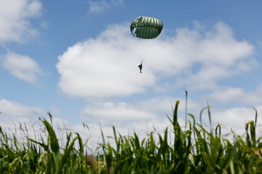 Parachute drop in Carentan-Les-Marais in Normandy, France on Sunday, June 02, 2024, ahead of D-Day 80th anniversary commemorations. (AP Photo/Jeremias Gonzalez)