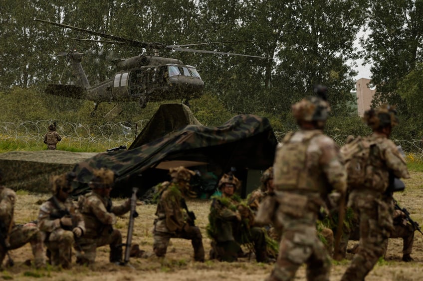 The US Army conducts an air assault demonstration in Carentan-Les-Marais in Normandy, France on Sunday, June 02, 2024, ahead of D-Day 80th anniversary commemorations. (AP Photo/Jeremias Gonzalez)