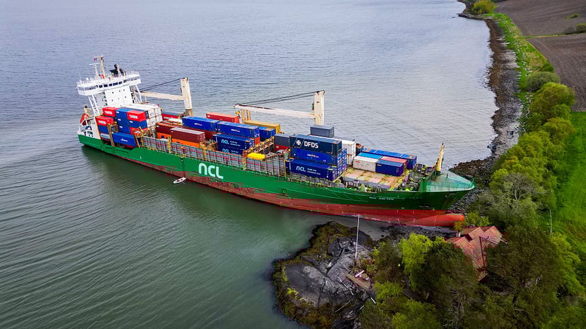 pictures norwegian man astonished to wake up to find cargo ship in his garden