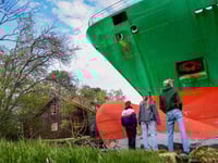 Pictures: Norwegian Man Astonished To Wake Up To Find Cargo Ship in His Garden