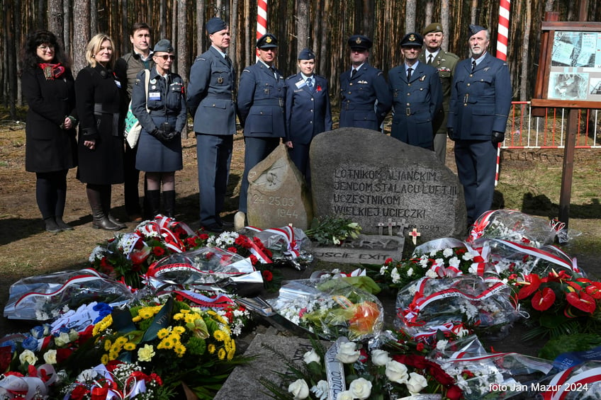 British soldiers pay tribute to Allied prisoners of war who tunneled out of a German POW camp during World War II on the 80th anniversary of the escape, in Zagan, Poland, Sunday March 24, 2024. The ingenious act of defiance has come to be known as the "Great Escape." Most of the soldiers who escaped from Stalag Luft III on the night of March 24, 1944, faced a tragic end. Only three made it to safety. The others were recaptured and 50 of them were executed. (AP Photo/Jan Mazur)