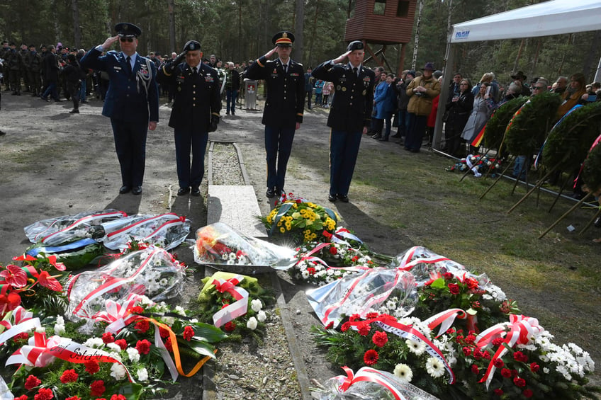 British soldiers pay tribute to Allied prisoners of war who tunneled out of a German POW camp during World War II on the 80th anniversary of the escape, in Zagan, Poland, Sunday March 24, 2024. The ingenious act of defiance has come to be known as the "Great Escape." Most of the soldiers who escaped from Stalag Luft III on the night of March 24, 1944, faced a tragic end. Only three made it to safety. The others were recaptured and 50 of them were executed. (AP Photo/Jan Mazur)