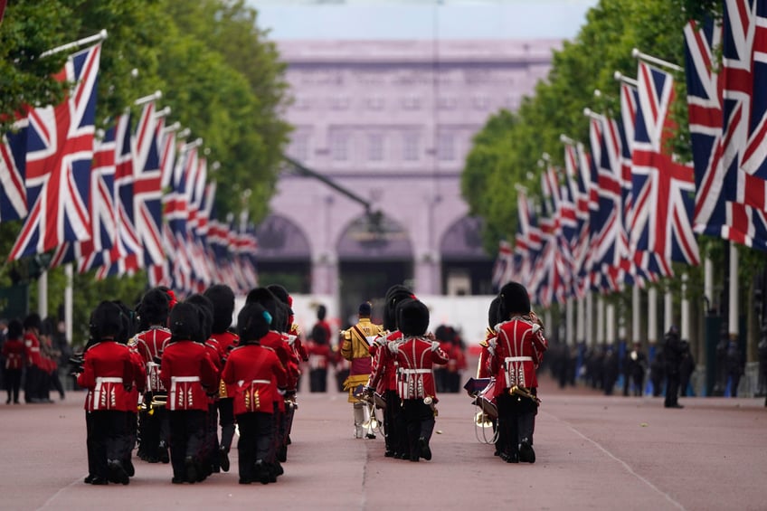 Soldiers from the Irish Guards march along the Mall as they take part in the Trooping the Color ceremony, in London, Saturday, June 15, 2024. Trooping the Color is the King's Birthday Parade and one of the nation's most impressive and iconic annual events attended by almost every member of the Royal Family. (AP Photo/Alberto Pezzali)