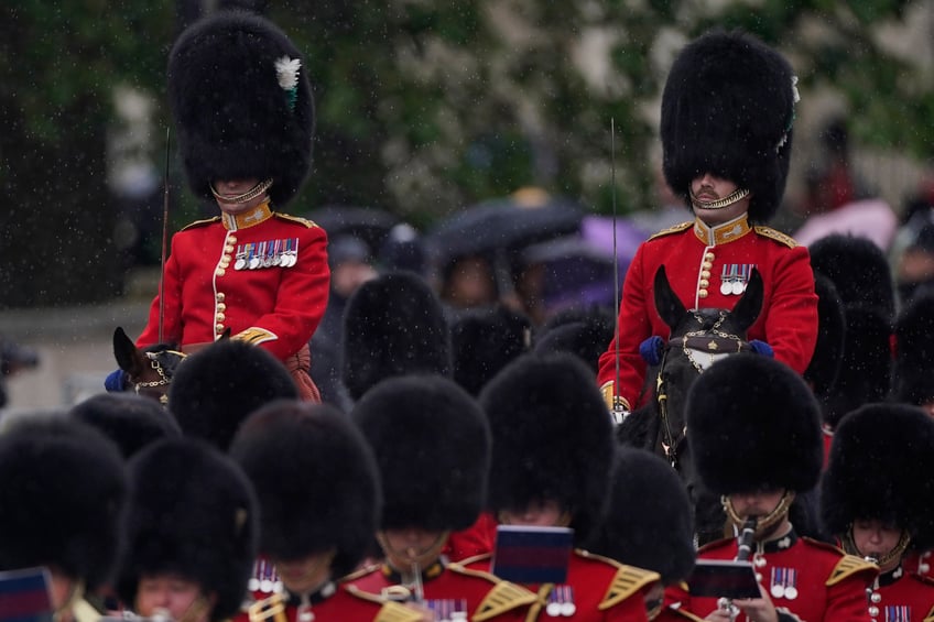Two mounted officers from the Welsh Guards take part in the Trooping the Color ceremony, in London, Saturday, June 15, 2024. Trooping the Color is the King's Birthday Parade and one of the nation's most impressive and iconic annual events attended by almost every member of the Royal Family. (AP Photo/Alberto Pezzali)