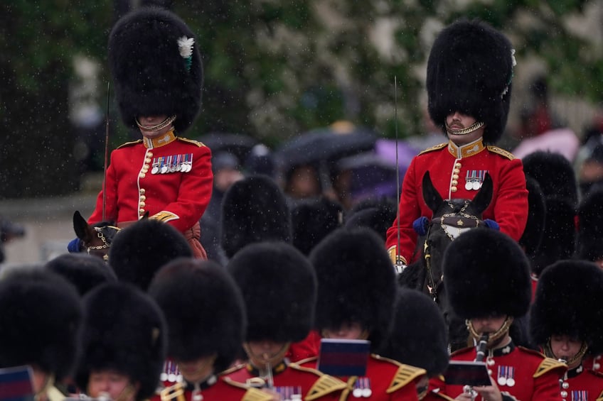 Two mounted officers from the Welsh Guards take part in the Trooping the Color ceremony, in London, Saturday, June 15, 2024. Trooping the Color is the King's Birthday Parade and one of the nation's most impressive and iconic annual events attended by almost every member of the Royal Family. (AP Photo/Alberto Pezzali)