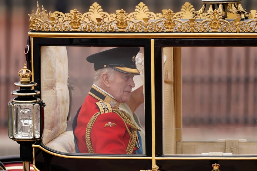 Britain's King Charles III rides in a carriage with Queen Camilla as they attend the Trooping the Color ceremony, in London, Saturday, June 15, 2024. Trooping the Color is the King's Birthday Parade and one of the nation's most impressive and iconic annual events attended by almost every member of the Royal Family. (AP Photo/Alberto Pezzali)