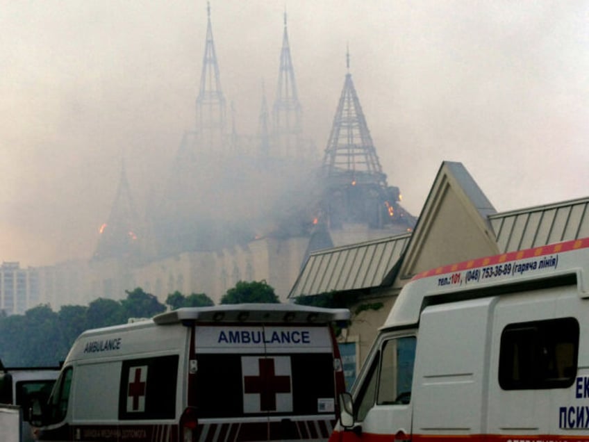 An ambulance is parked outside the Palace of Students of the Odesa Law Academy, which is o