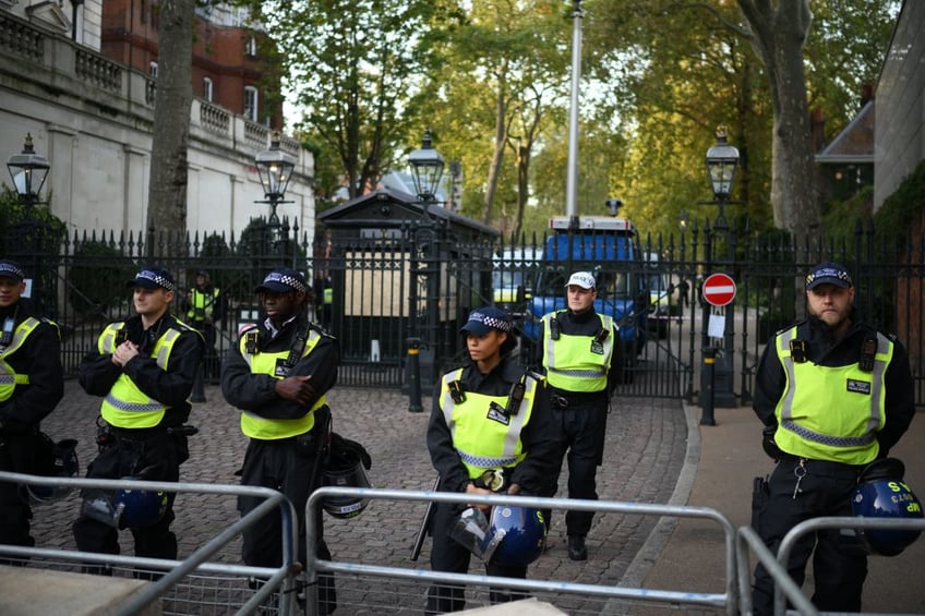 pictures workers board up windows ahead of free palestine protest at israeli embassy london