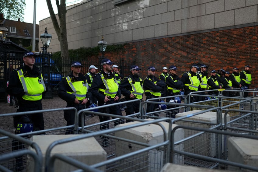 pictures workers board up windows ahead of free palestine protest at israeli embassy london