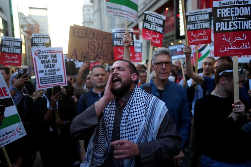 pictures workers board up windows ahead of free palestine protest at israeli embassy london