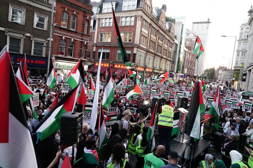 pictures workers board up windows ahead of free palestine protest at israeli embassy london