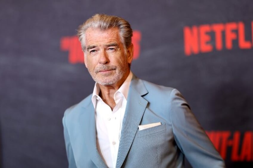 Pierce Brosnan has been given a citation for starying off the beaten path in a geothermal area of Yellowstone Park