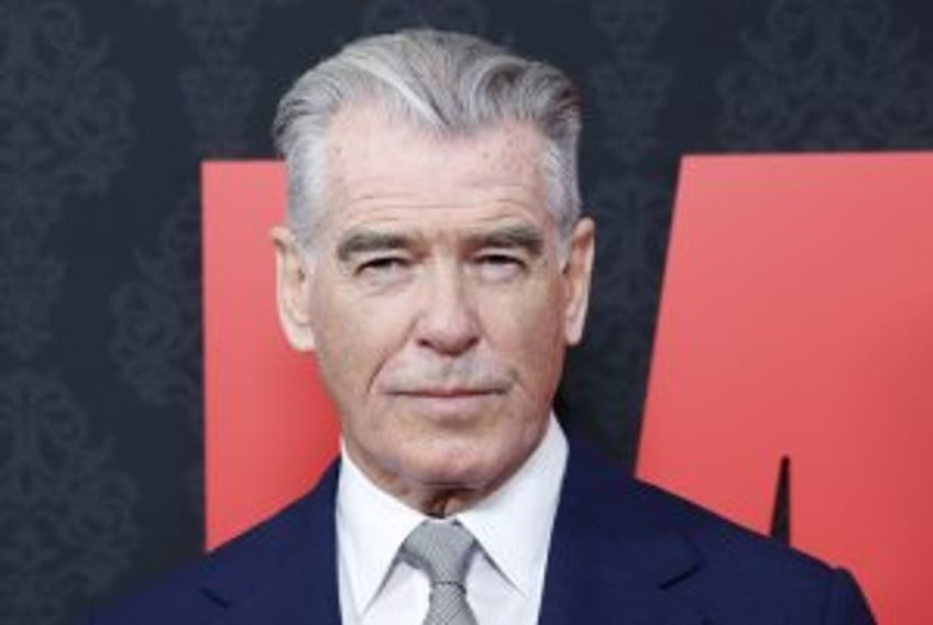 Pierce Brosnan paints on the beach in 'Four Letters of Love'