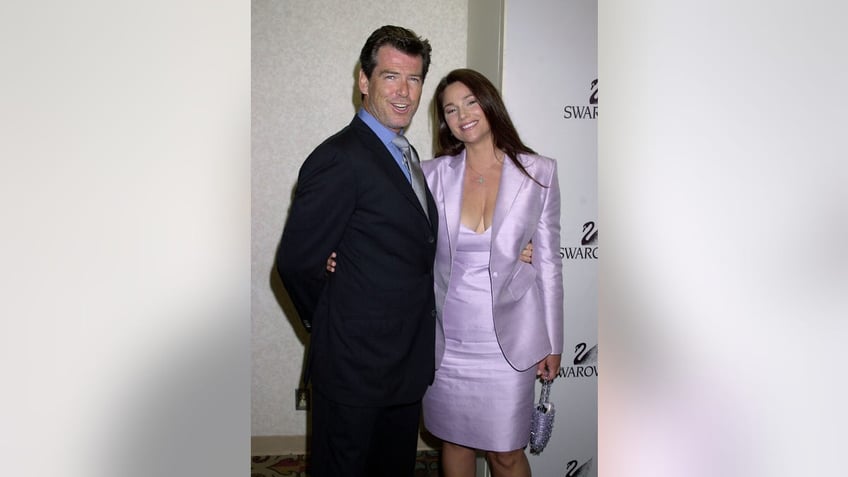 PIerce Brosnan and Keely Shaye Smith posing together