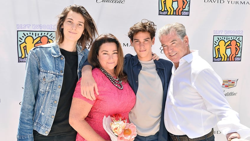 Dylan Brosnan, Pierce Brosnan, Keely Shaye Smith and Paris Brosnan posing together