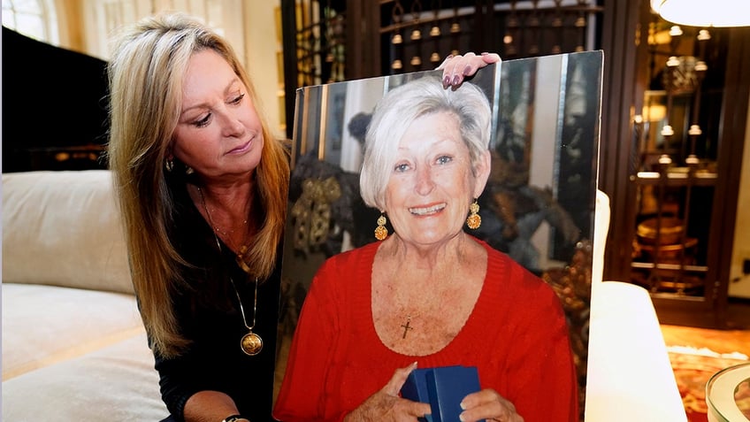 M.J. Jennings holding a photo