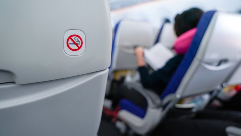 no smoking sign plane