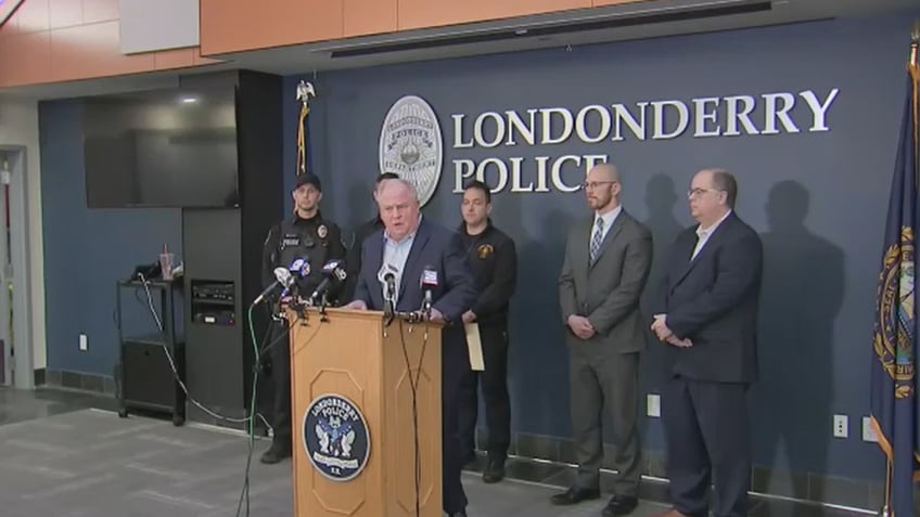 Londonderry Chairman John Farell Town Council, Police officers, Fire chief Butler, Mayor of Manchester, Ted Kitchens airport director,