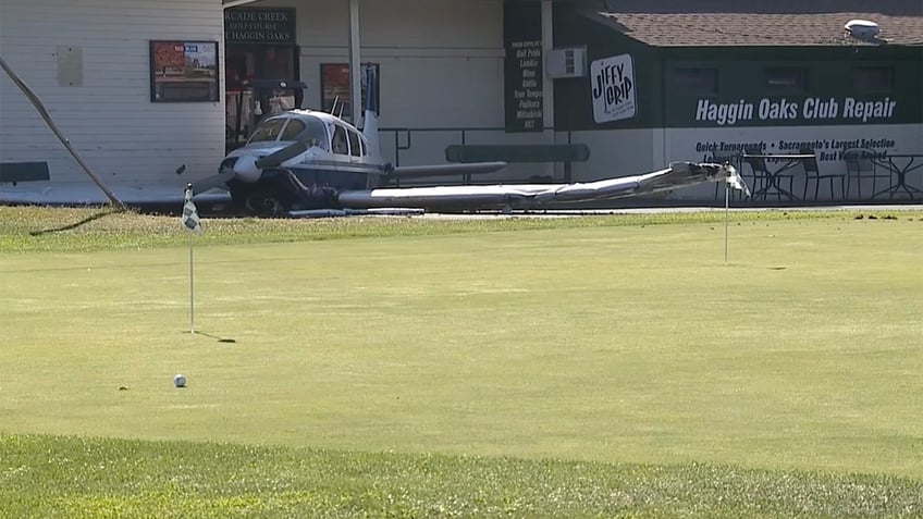 Plane next to golf pro shop