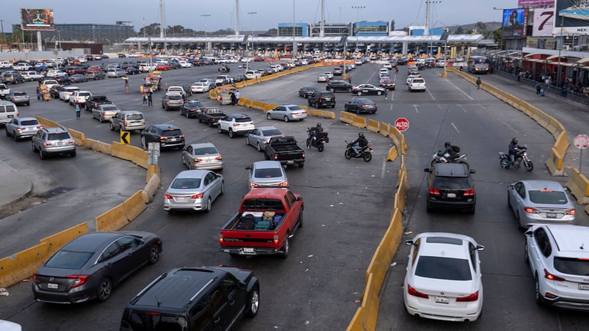 Cars along southern border entering US