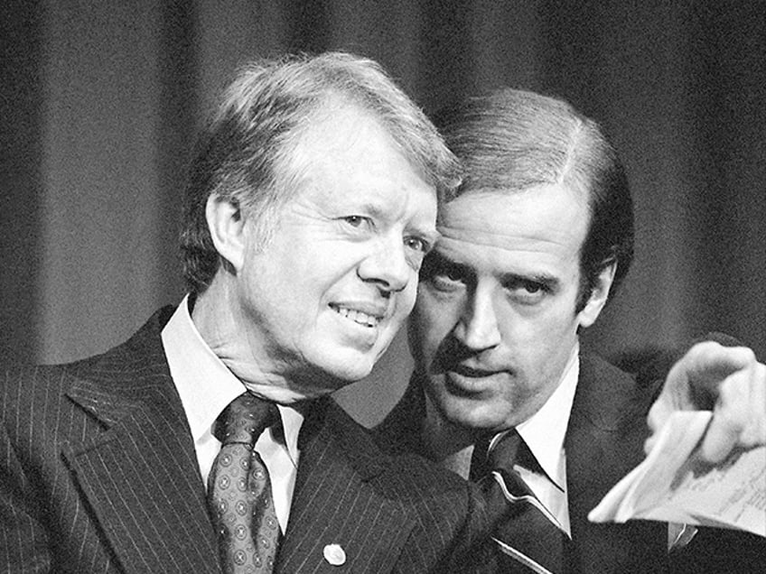 FILE - President Jimmy Carter listens to Sen. Joseph R. Biden, D-Del., as they wait to spe