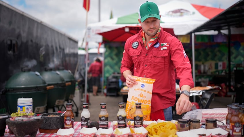 Juventino Alanis of the Sociedad Mexicano de Parrillieros team prepares food for tasting at the World Championship Barbecue Cooking Contest