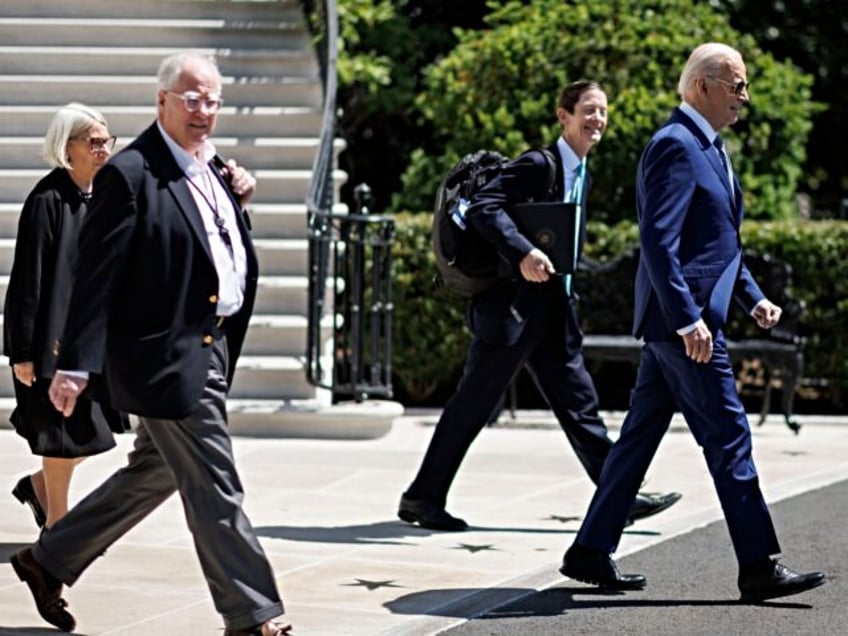 US President Joe Biden, right, and Anita Dunn, senior advisor to US President Joe Biden, f