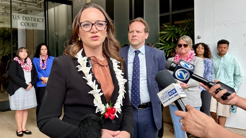 Attorney Kristina Baehr, who represents U.S. military families suing the United States over a 2021 jet fuel leak into a Navy water system in Hawaii, speaks to reporters outside federal court