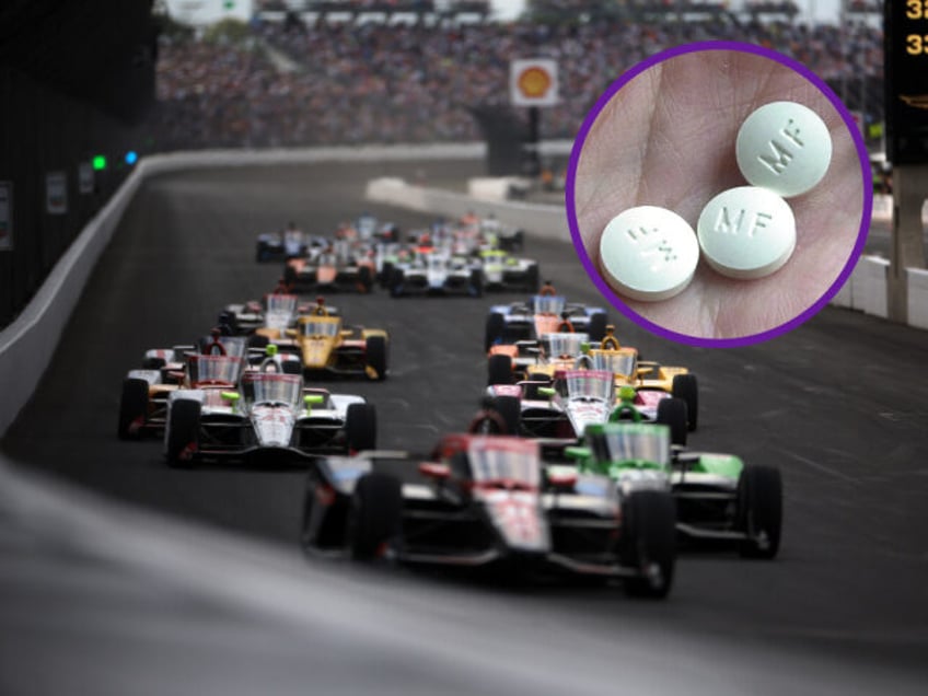 INDIANAPOLIS, INDIANA - MAY 26: Cars race during the 108th Running of the Indianapolis 500
