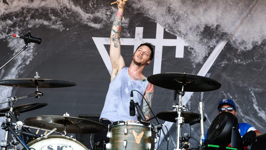 Daniel Williams plays the drums during concert.
