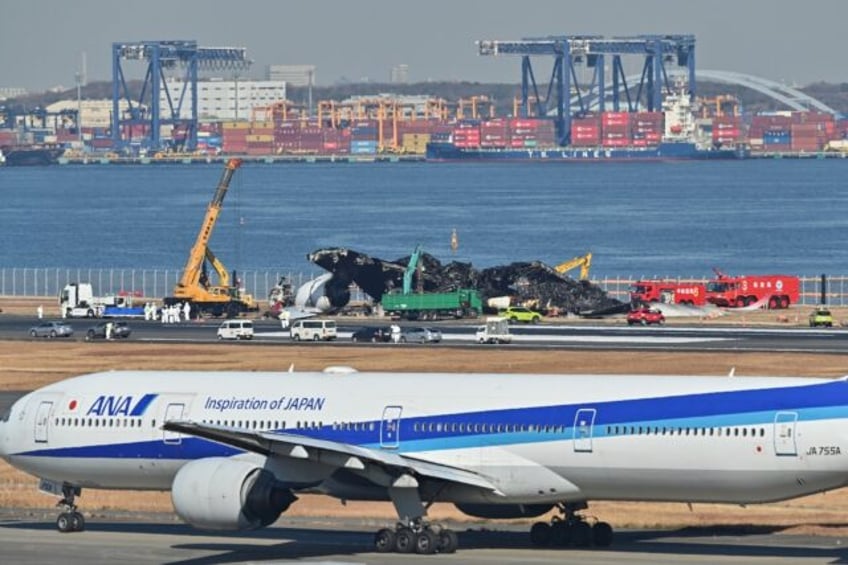 All 367 passengers and 12 crew on board the Japan Airlines plane escaped down emergency slides