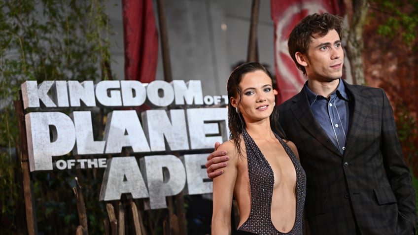 Actors Owen Teague and Freya Allan appearing at an event