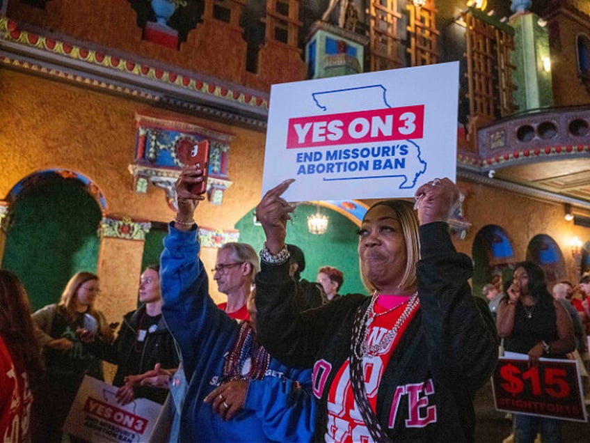 Supporters and organizers of Amendment 3 and Proposition A celebrate the results of the el