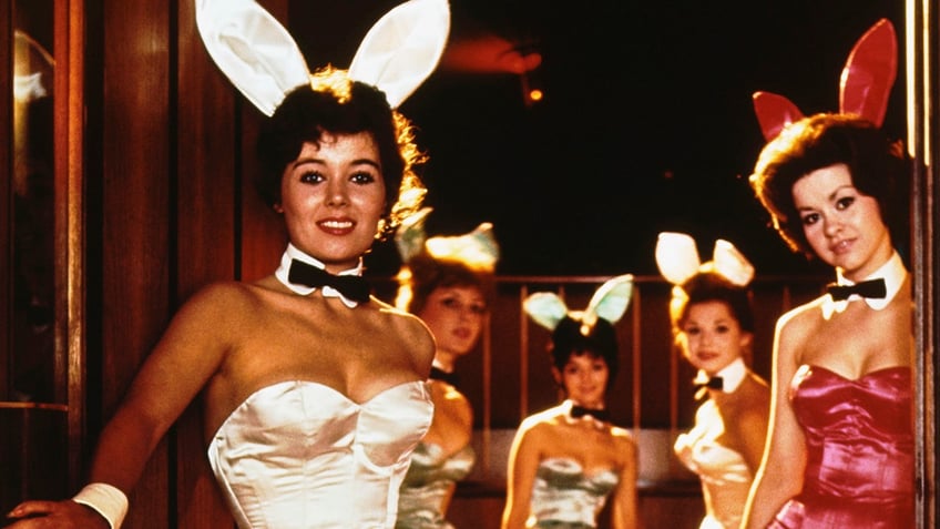 Playboy Bunnies greeting guests at the door