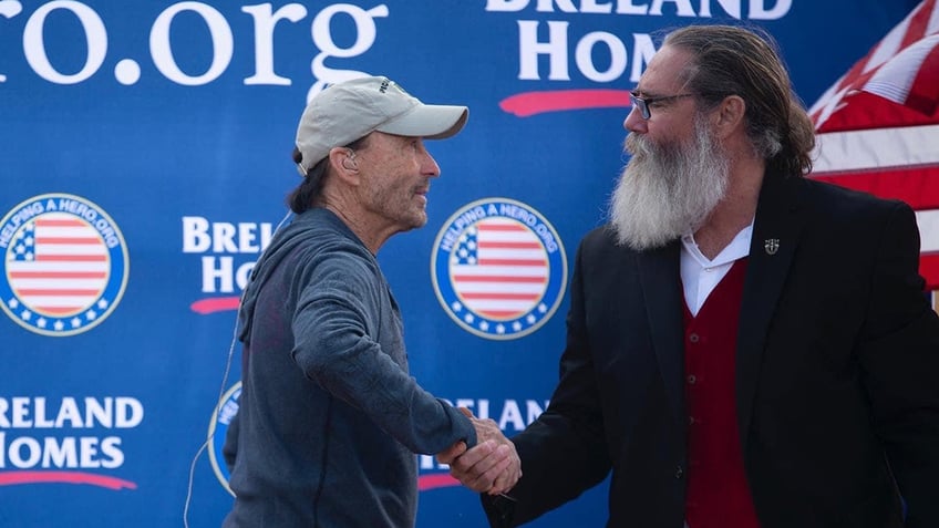 Lee Greenwood shaking hands