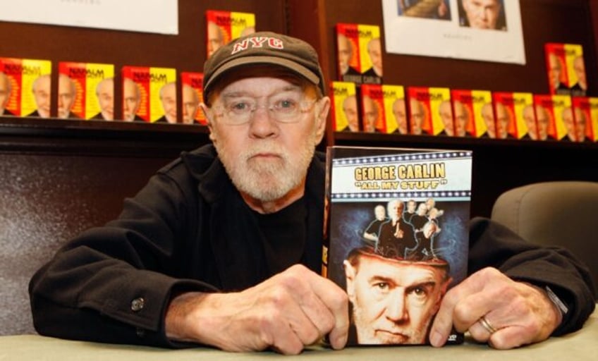 George Carlin poses with his book "All My Stuff" on December 11, 2007 in Los Angeles, Cali