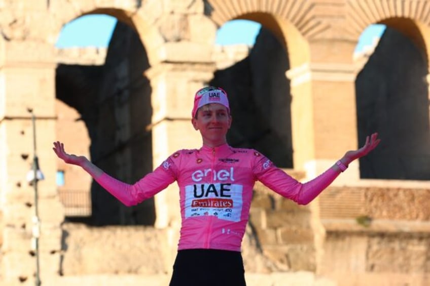 Team UAE's Slovenian rider Tadej Pogacar celebrates his first Giro d'Italia success in Rom