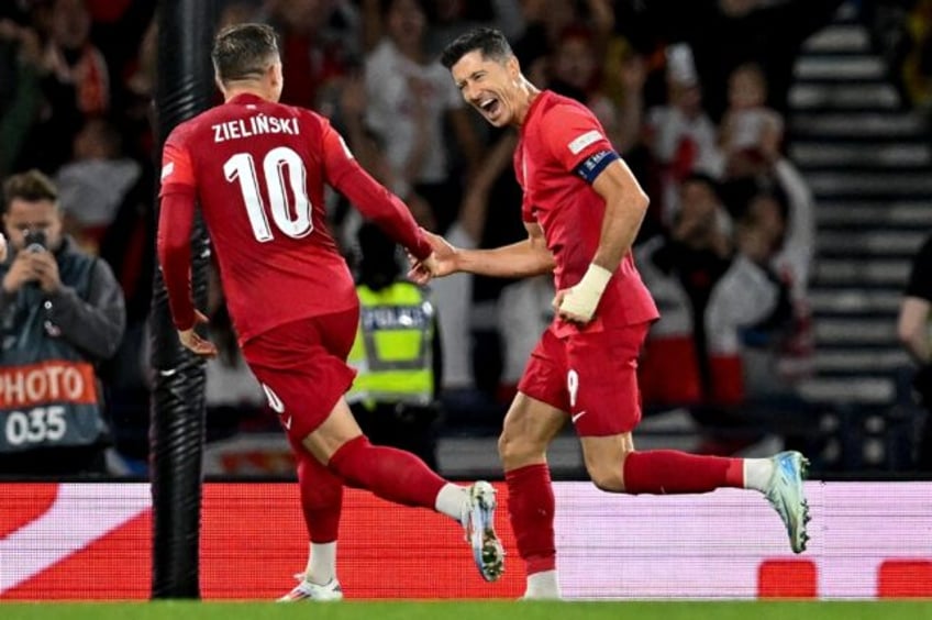 Robert Lewandowski (right) was on target in Poland's 3-2 victory over Scotland