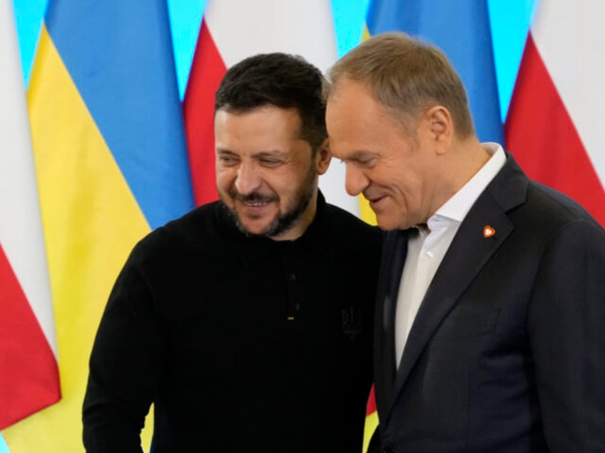 Polish Prime Minister Donald Tusk, right, welcomes Ukrainian President Volodymyr Zelenskyy