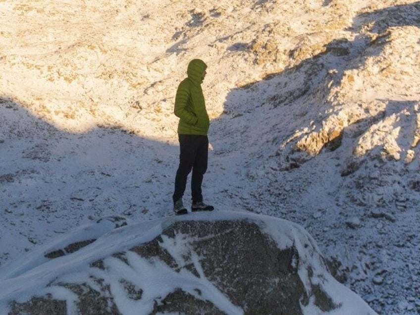 Man standing on on rocky mountain ridge, British Columbia, Canada. (Cavan via Getty)