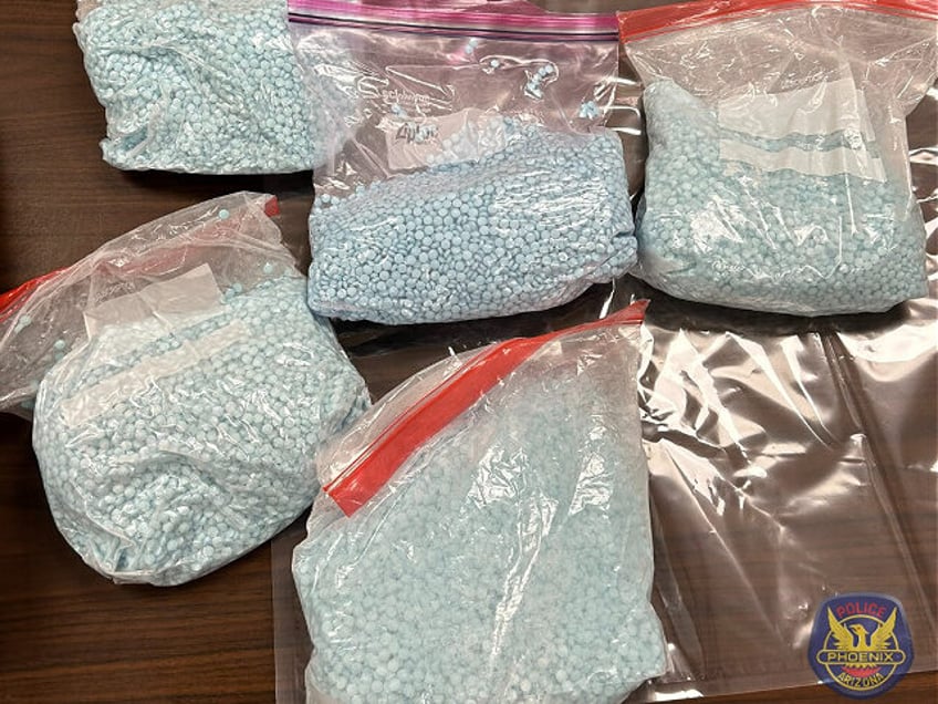 Nearly 14 pounds of powdered fentanyl and 50,000 pressed pills were reportedly seized by p