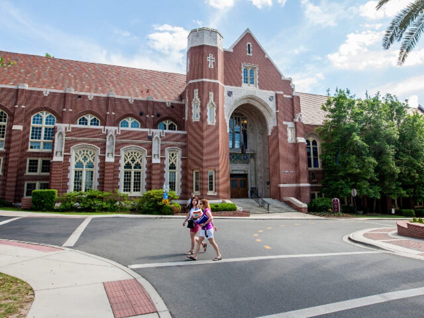 Students walk past the Dodd Hall on the campus of Florida State University in Tallahassee,