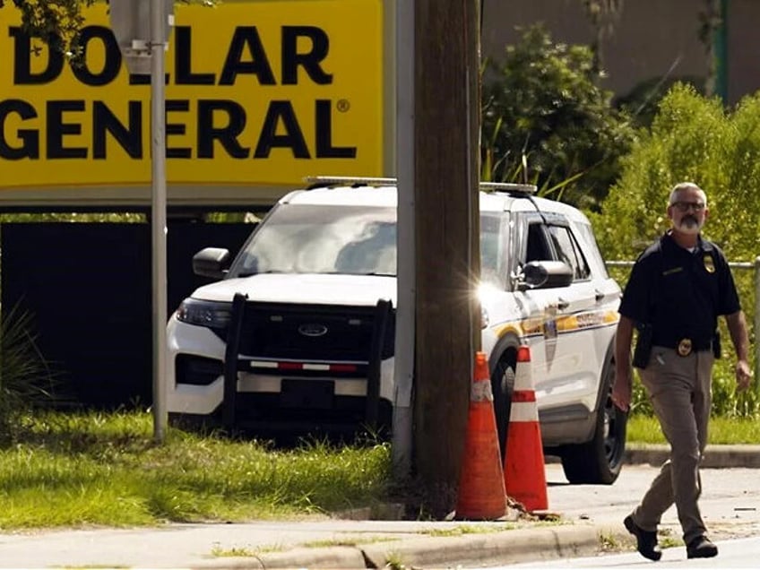 police armed bystander shoots dollar general robber dead