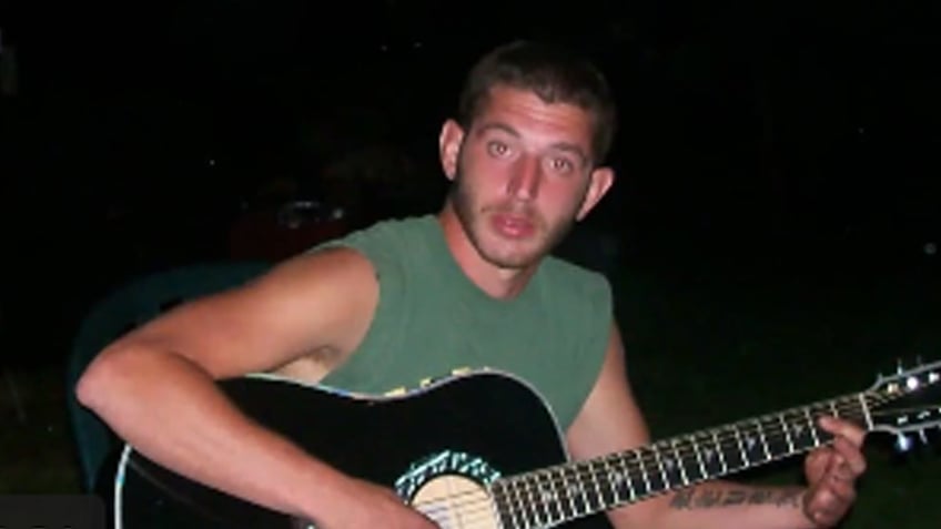 Robert Irwin playing guitar