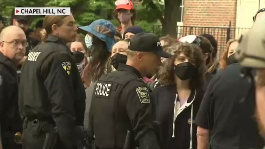 UNC students protest as guards stand