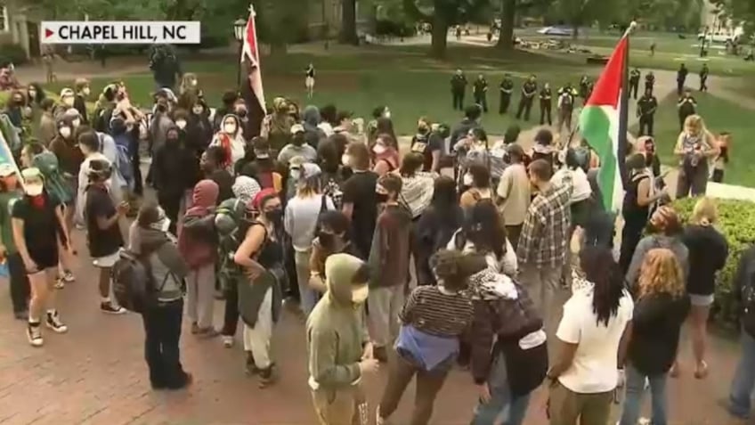 UNC students protest as guards stand