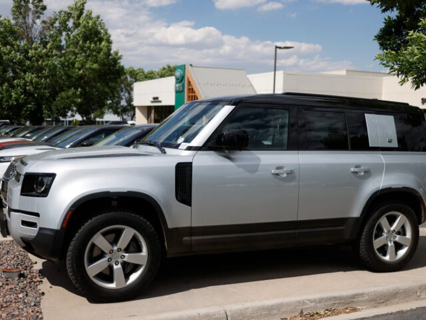 In this Sunday, June 14, 2020, photograph, an unsold 2020 Defender sports-utility vehicles