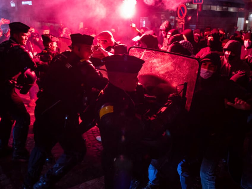 Protesters and police clash during a rally against the "Israel is Forever" gala